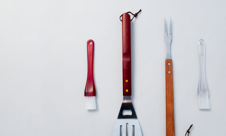 Kitchen tools laying on the white surface