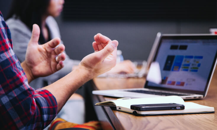 Person gesticulating during the meeting