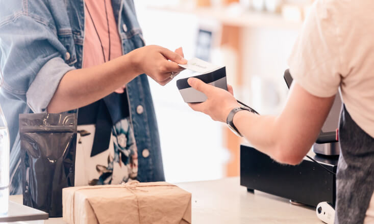 Women paying for goods with credit card